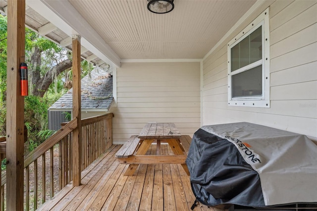 wooden deck featuring area for grilling