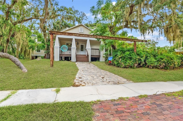 view of front of property with a front lawn and a porch