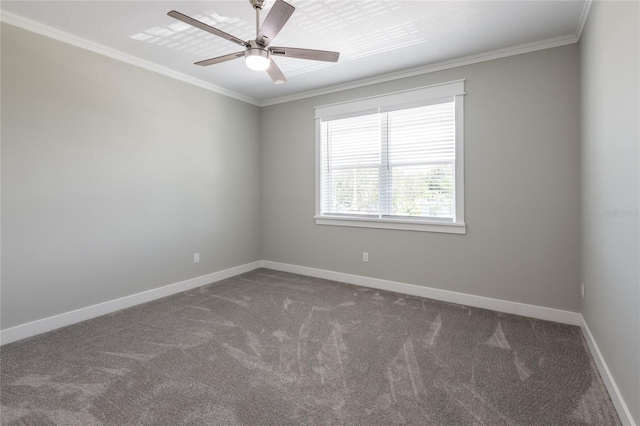 empty room featuring carpet floors, baseboards, and crown molding