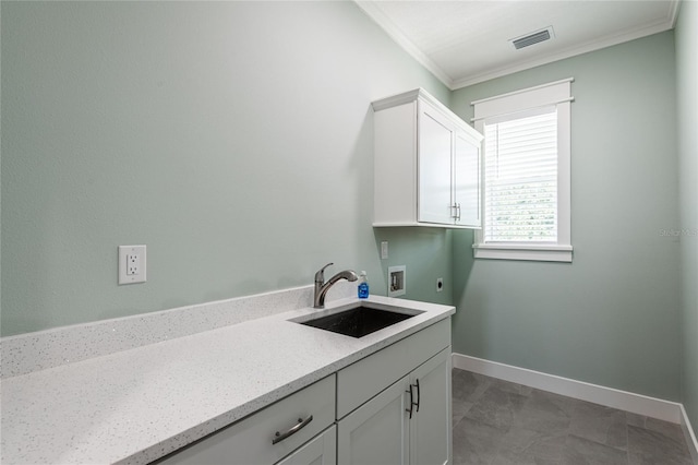 laundry room featuring cabinets, washer hookup, ornamental molding, electric dryer hookup, and sink