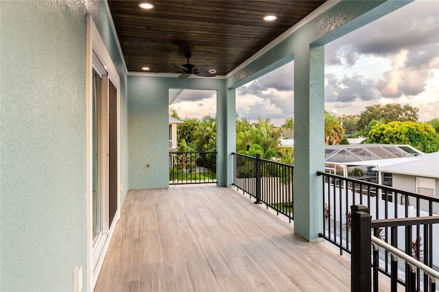 wooden deck featuring ceiling fan