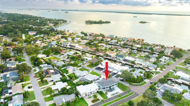 bird's eye view featuring a water view and a residential view