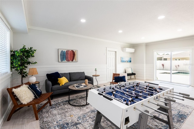 rec room with recessed lighting, a wainscoted wall, a wall mounted air conditioner, and crown molding