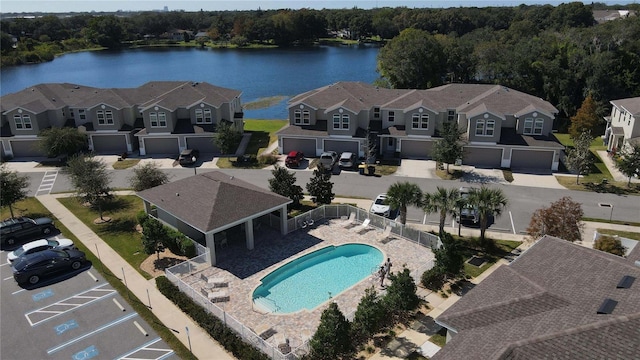 birds eye view of property featuring a water view