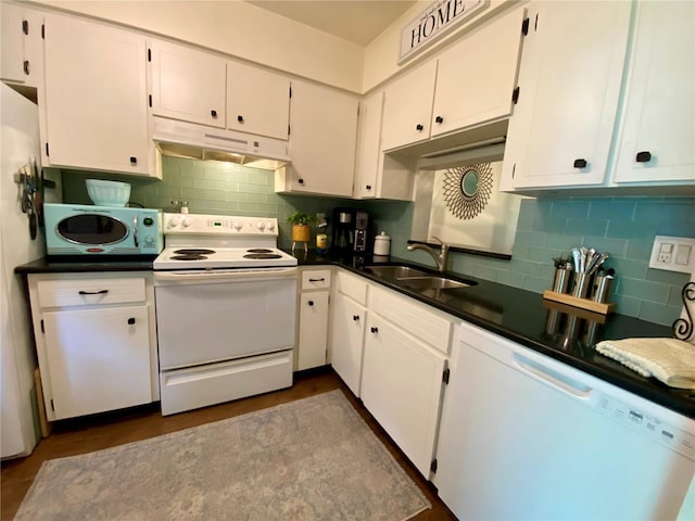 kitchen with sink, white cabinets, and white appliances