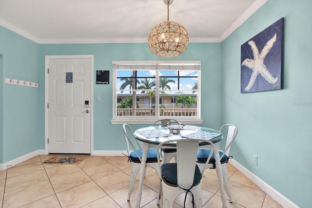 dining area with ornamental molding, tile patterned flooring, and baseboards