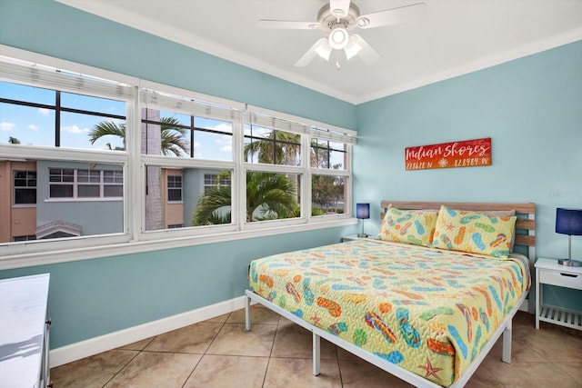 tiled bedroom featuring baseboards and a ceiling fan