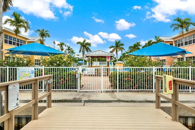 wooden deck featuring fence and a gazebo