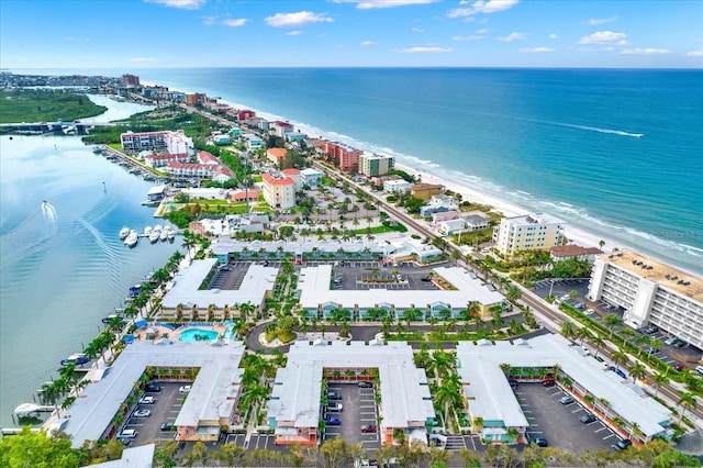 drone / aerial view featuring a view of the beach and a water view