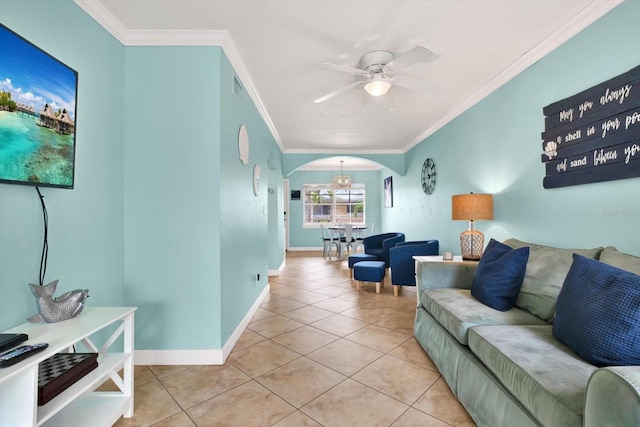 living room featuring ceiling fan, crown molding, and light tile patterned flooring