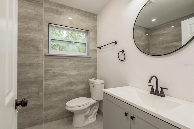 bathroom with toilet and vanity