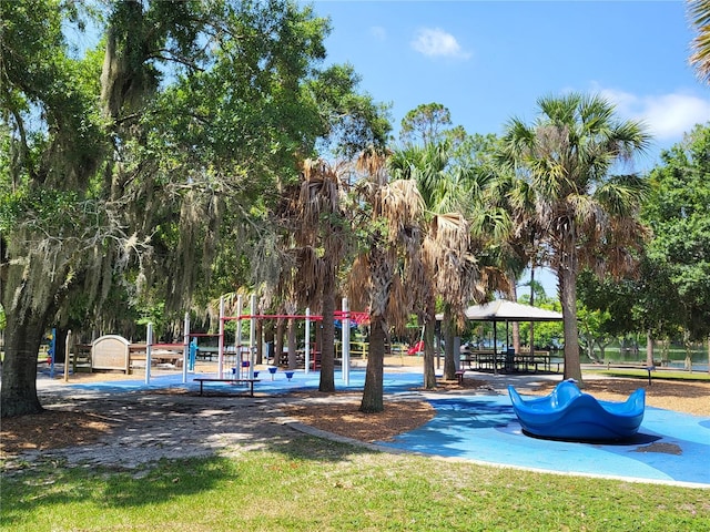 surrounding community featuring a playground and a gazebo