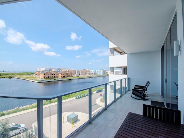 balcony featuring a water view