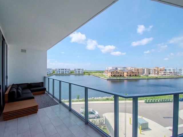 balcony featuring a water view