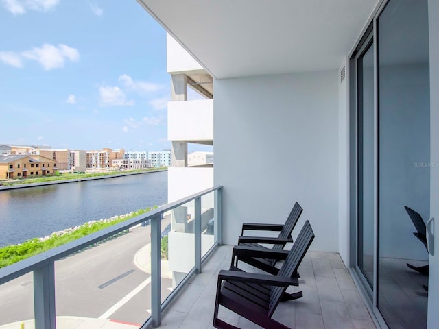 balcony featuring a water view