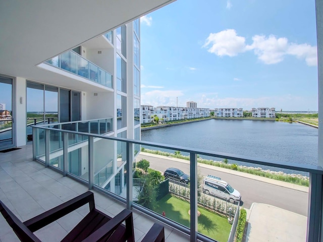 balcony featuring a water view