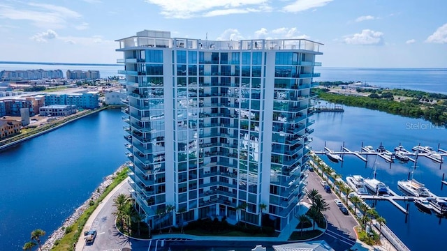 birds eye view of property featuring a water view