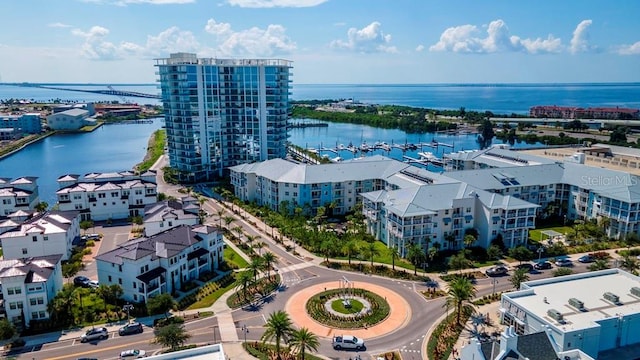 birds eye view of property with a water view