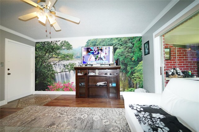 interior space featuring crown molding, a textured ceiling, hardwood / wood-style flooring, and ceiling fan