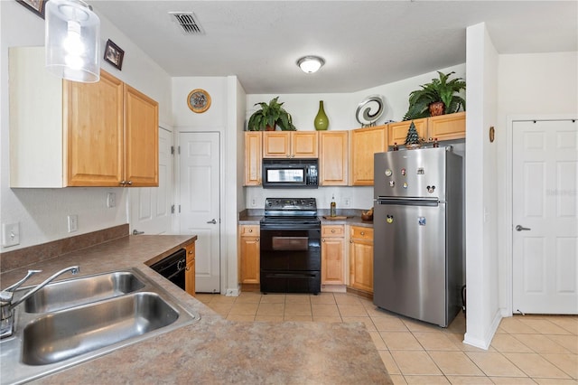 kitchen with sink, black appliances, light brown cabinets, and light tile patterned floors