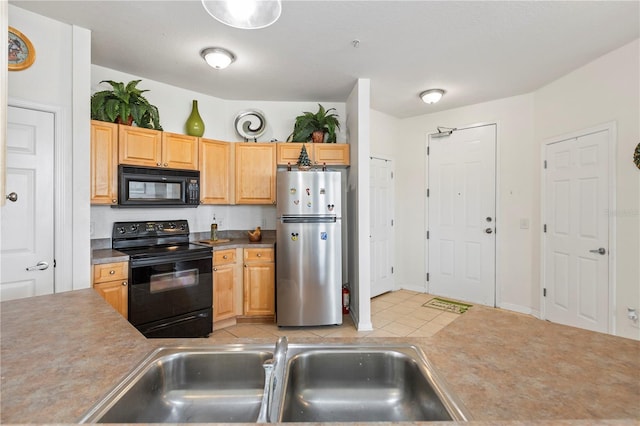 612 Terrace Ridge Cir Unit 612, Davenport, FL 33896 - kitchen featuring black appliances, a sink, and light tile patterned flooring