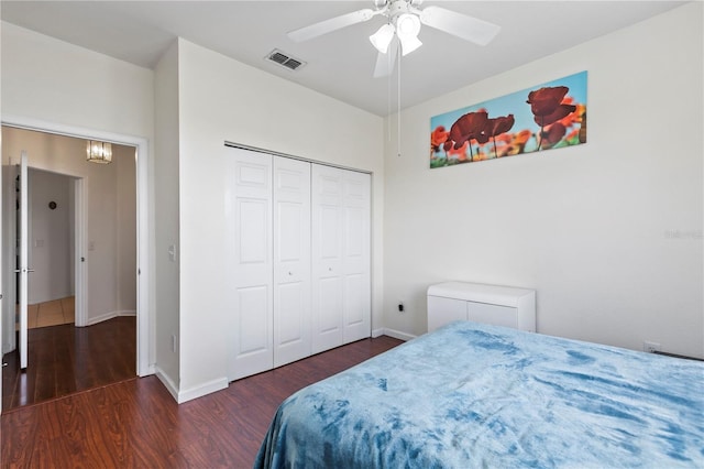 612 Terrace Ridge Cir Unit 612, Davenport, FL 33896 - bedroom with wood finished floors, baseboards, a closet, ceiling fan, and a chandelier