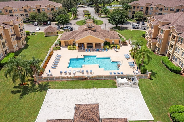 view of pool with a yard and a patio