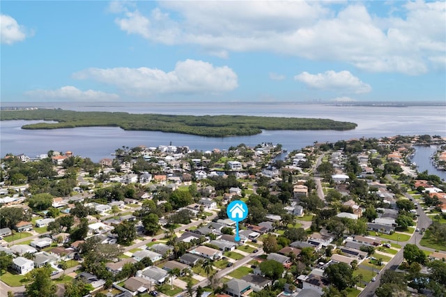 drone / aerial view featuring a residential view and a water view