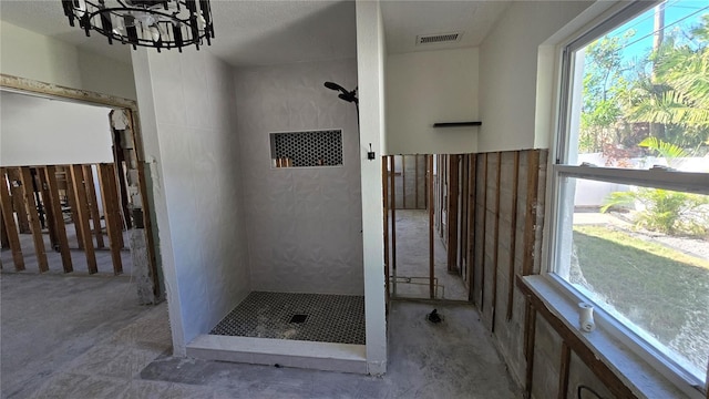 full bath featuring a shower stall and visible vents