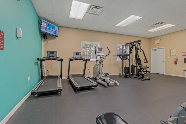 gym featuring a drop ceiling