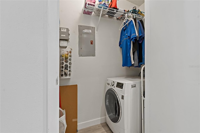 laundry room featuring washer / clothes dryer and electric panel