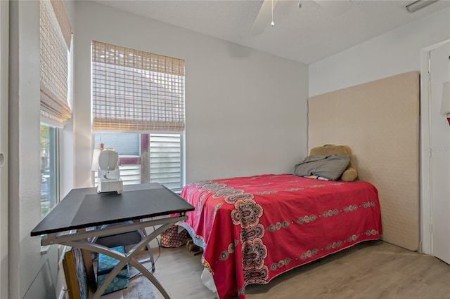 bedroom featuring ceiling fan and hardwood / wood-style floors