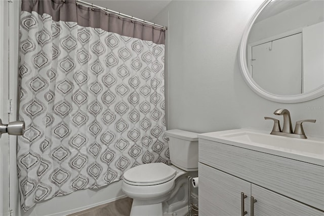 full bathroom featuring vanity, shower / bath combination with curtain, and toilet