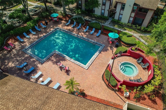 view of pool featuring a community hot tub