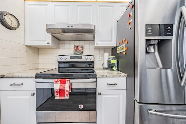 kitchen with white cabinetry, backsplash, stainless steel appliances, and light stone counters