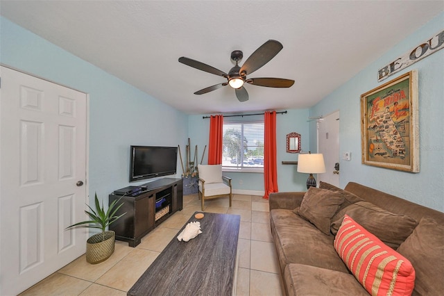 living room with ceiling fan and light tile patterned floors