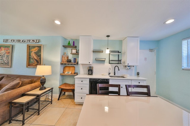 kitchen featuring white cabinetry, sink, dishwasher, and pendant lighting