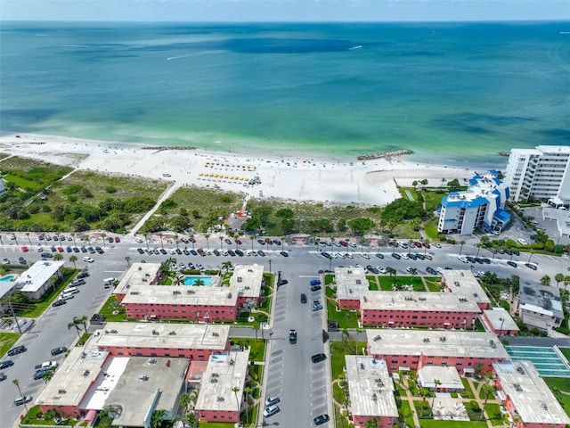 drone / aerial view with a water view and a view of the beach