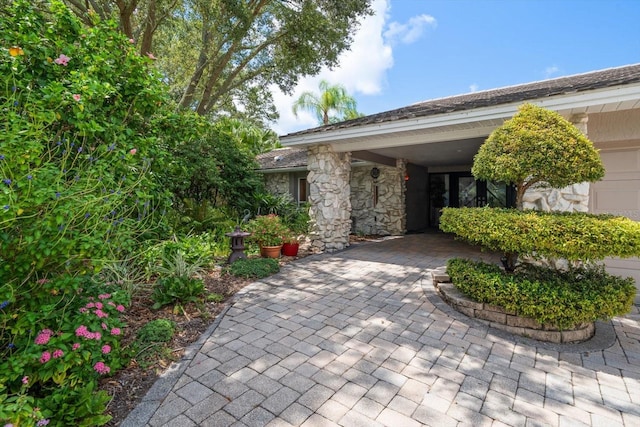 view of exterior entry with a garage