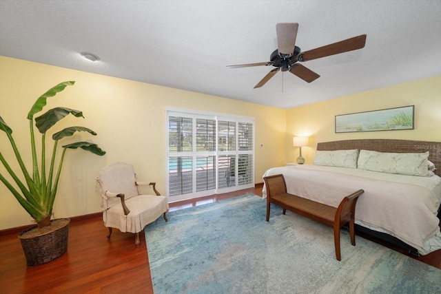 bedroom with ceiling fan and hardwood / wood-style floors