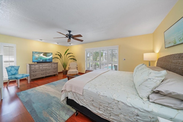 bedroom with ceiling fan and dark hardwood / wood-style floors