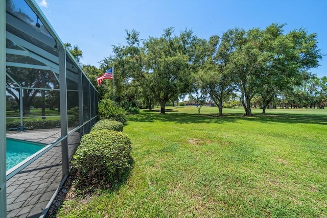 view of yard with a lanai