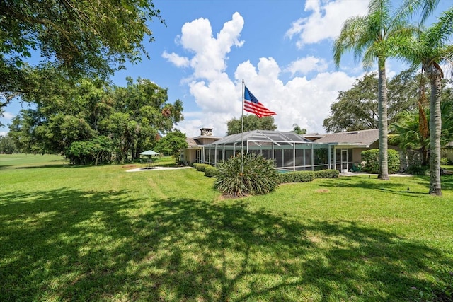 view of yard featuring a lanai