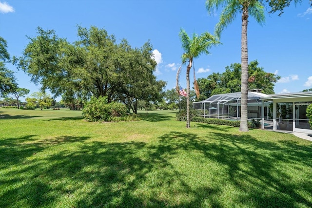 view of yard with a lanai