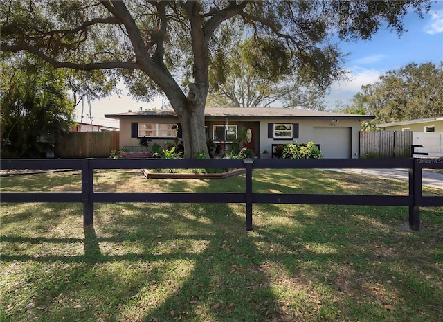 ranch-style house with a garage and a front yard