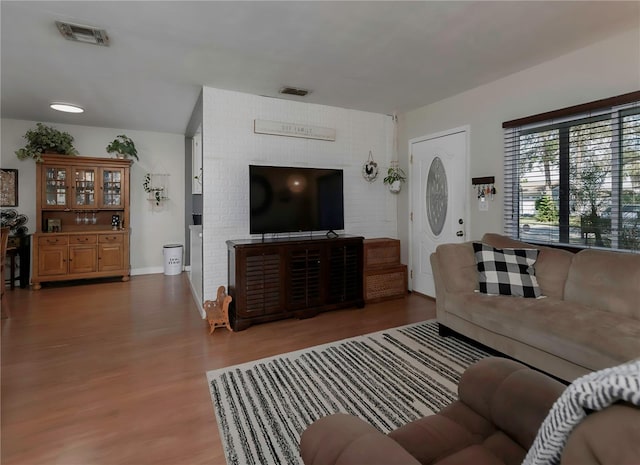 living room with dark hardwood / wood-style flooring