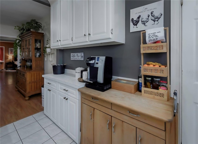 kitchen featuring white cabinetry and light hardwood / wood-style flooring