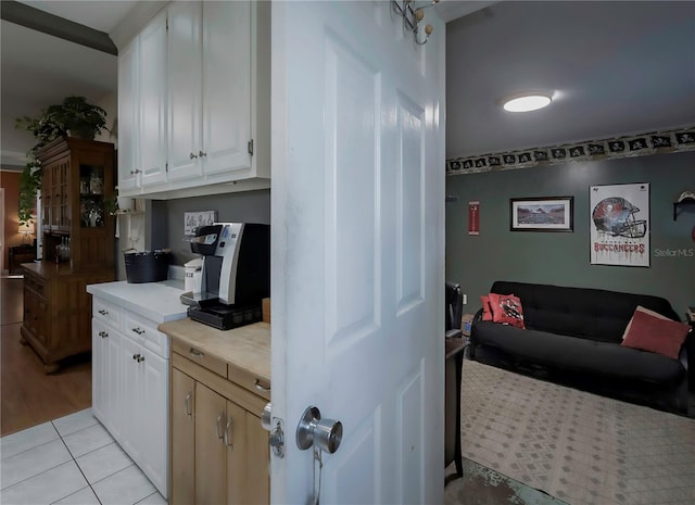 kitchen featuring white cabinets and light wood-type flooring