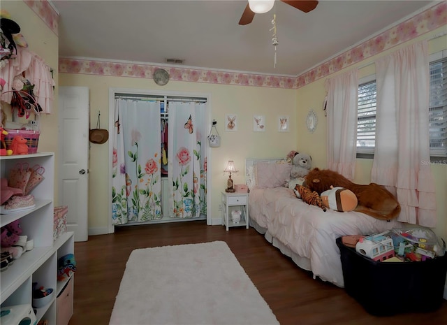 bedroom featuring ceiling fan and dark hardwood / wood-style floors