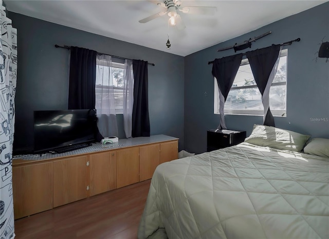 bedroom featuring ceiling fan and light hardwood / wood-style flooring